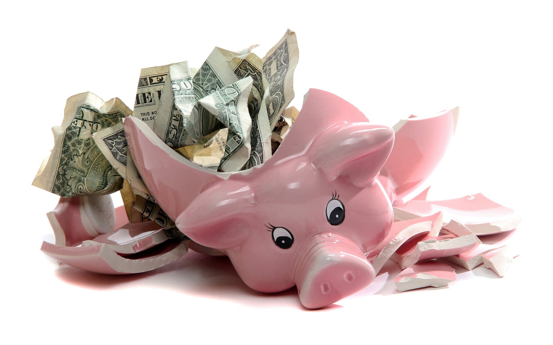 A broken pink piggy bank with crumpled US dollar bills spilling out, captured in HD quality for a PC desktop wallpaper background.