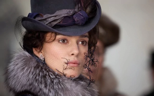 HD desktop wallpaper featuring a close-up of Keira Knightley as Anna Karenina from the 2012 movie, dressed in period costume with a hat and fur collar.