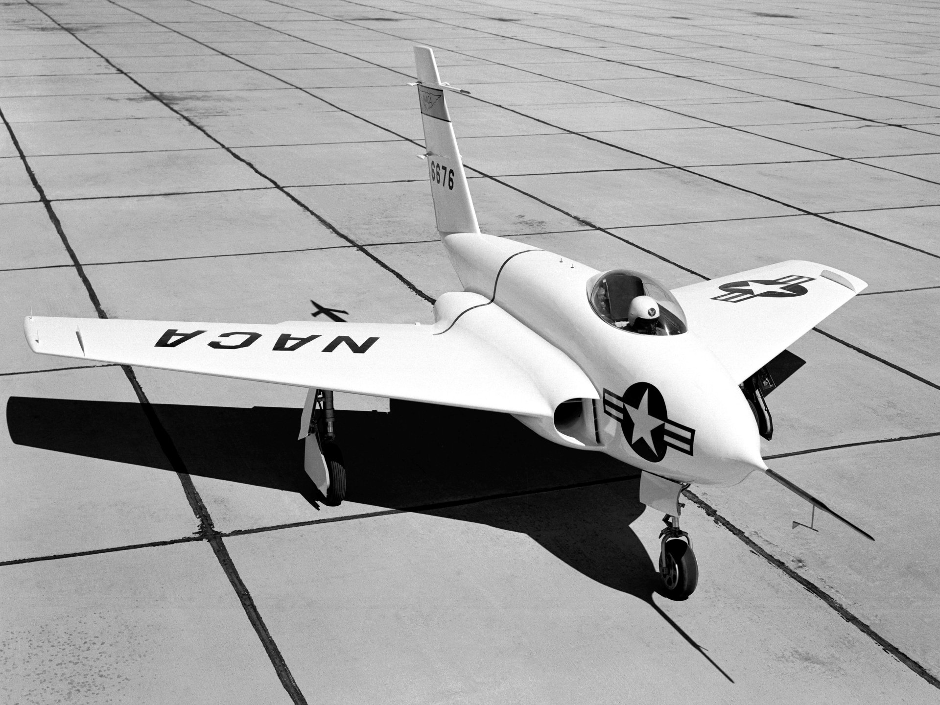 Black-and-white 4K Ultra HD PC desktop wallpaper of a Northrop X-4 Bantam jet with US military markings parked on a tiled flightline.