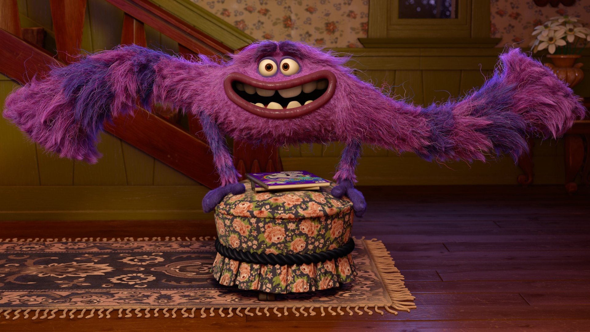 A vibrant purple monster from Monsters University stands playfully on a floral ottoman, capturing the fun and whimsy of the film. This HD image serves as a colorful desktop wallpaper.