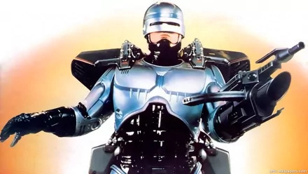 RoboCop (1987) movie HD PC desktop wallpaper: chrome-armored cyborg police officer aiming a weapon, posed heroically against a warm, glowing gradient background.