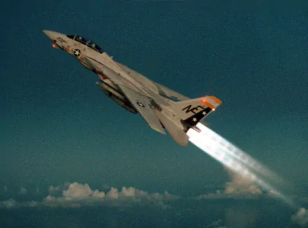Military Grumman F-14 Tomcat climbing with afterburners lit against a deep blue sky — 2K Quad HD PC desktop wallpaper/background.