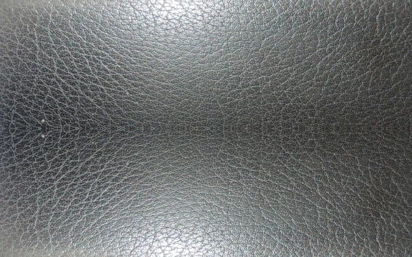 HD PC desktop wallpaper featuring an abstract textured surface resembling dark, cracked leather with subtle lighting variations.