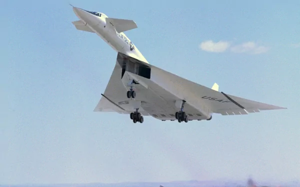 Military North American XB-70 Valkyrie in flight over a clear blue sky, close-up view — 2K Quad HD PC desktop wallpaper/background.