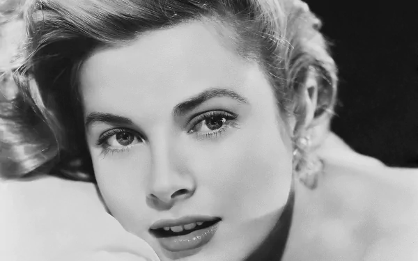 Black and white HD desktop wallpaper featuring a close-up portrait of celebrity Grace Kelly with soft lighting and elegant expression.