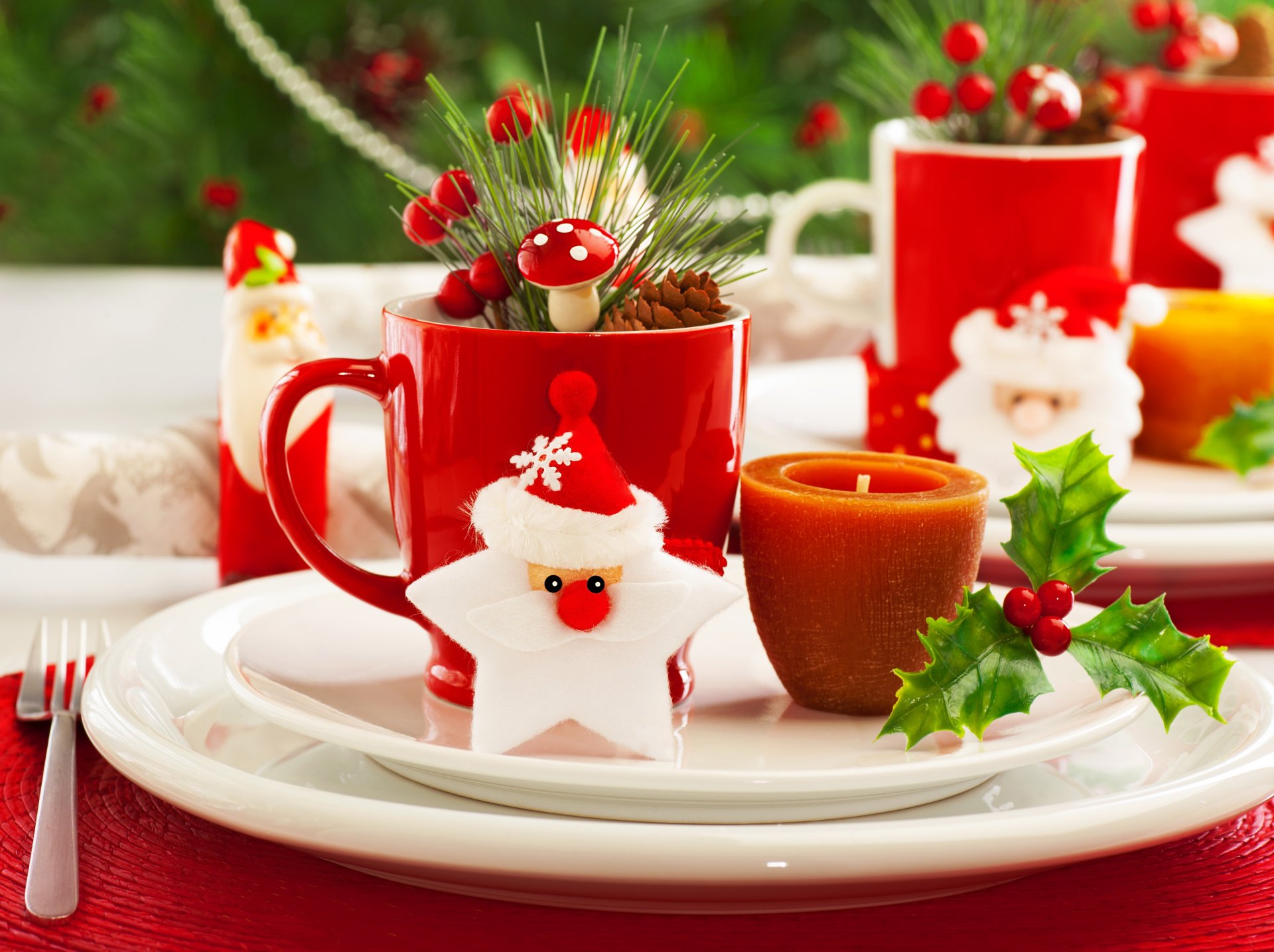 A festive HD Christmas-themed desktop wallpaper featuring red mugs, holiday decorations, and cheerful table settings, evoking a warm holiday spirit.