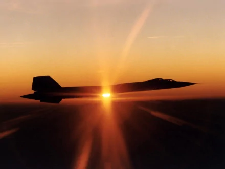 HD desktop wallpaper featuring the military Lockheed SR-71 Blackbird flying against a sunset sky, with the sun's rays creating a dramatic silhouette effect.