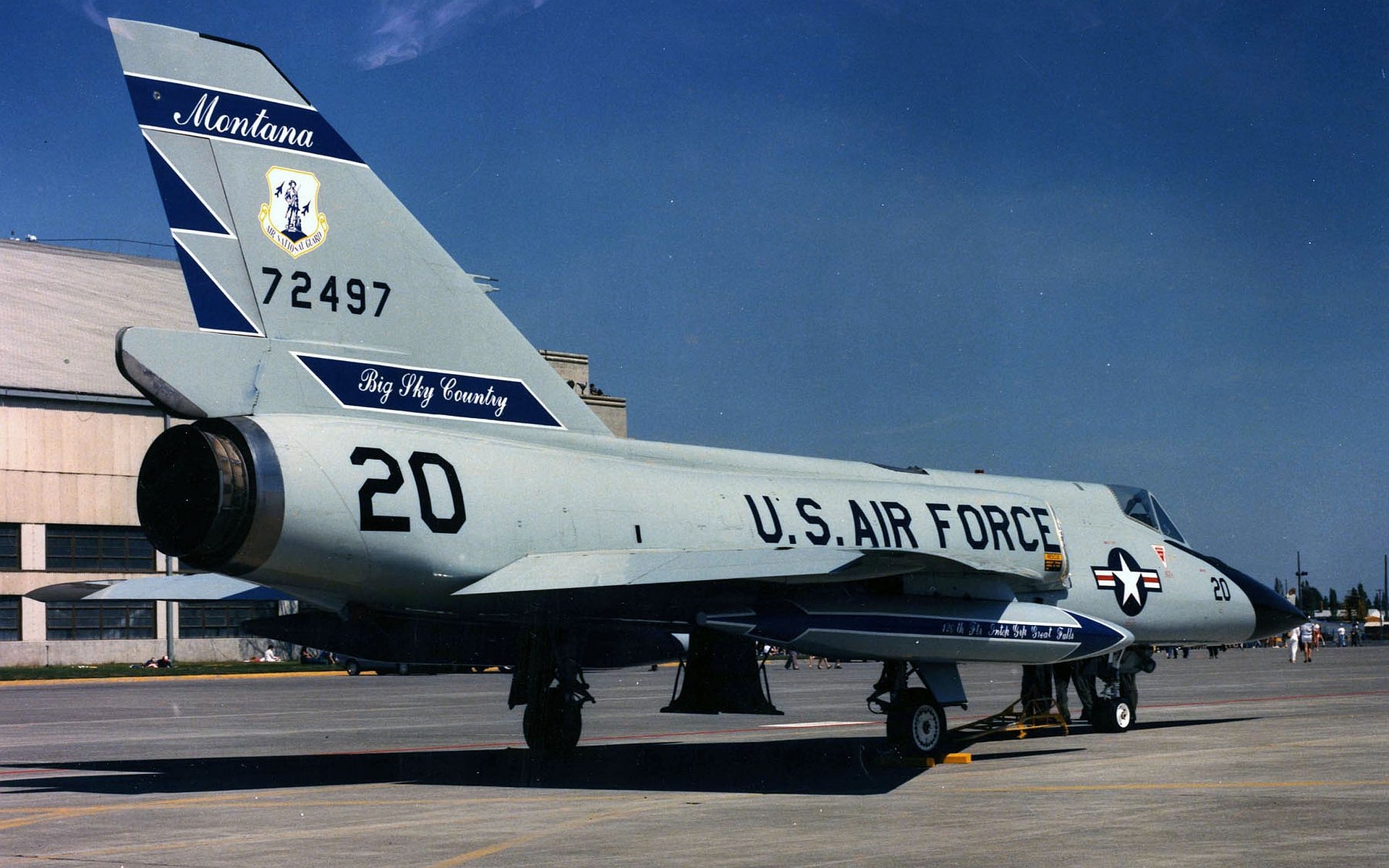 HD desktop wallpaper featuring a U.S. Air Force Convair F-106 Delta Dart military jet parked on a runway under a clear blue sky.