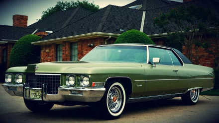 HD desktop wallpaper featuring a classic 1971 Cadillac Coupe DeVille parked in front of a suburban brick house under soft daylight.