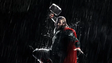 Thor from the movie Thor: The Dark World stands in pouring rain, cape billowing and Mjolnir raised — HD PC desktop wallpaper/background.