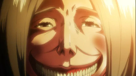 HD desktop wallpaper from Attack On Titan featuring a close-up of a grinning character with golden hair and shining eyes.