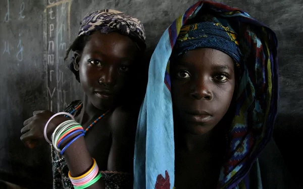 HD PC desktop wallpaper featuring a close-up portrait of two women against a dark, textured background, highlighting vibrant headscarves and colorful bracelets in a photography style.