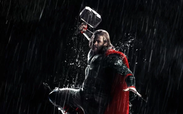 Thor from the movie Thor: The Dark World stands in pouring rain, cape billowing and Mjolnir raised — HD PC desktop wallpaper/background.