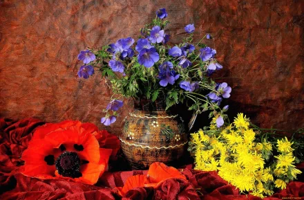 A vibrant still life featuring a vase filled with blue, yellow, and red flowers, including poppies, set against a rich background. A colorful, HD desktop wallpaper.