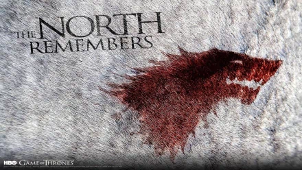 HD desktop wallpaper featuring the phrase The North Remembers accompanied by a stylized wolf imagery, inspired by the TV show Game of Thrones.