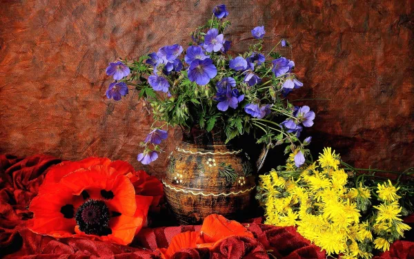 A vibrant still life featuring a vase filled with blue, yellow, and red flowers, including poppies, set against a rich background. A colorful, HD desktop wallpaper.