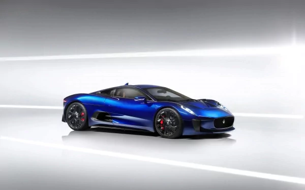 HD desktop wallpaper featuring a sleek blue Jaguar C-X75 sports vehicle in a minimalist, futuristic setting.