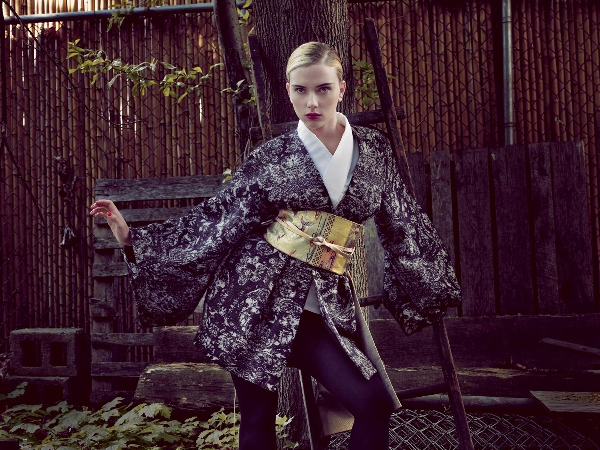 Scarlett Johansson poses elegantly in a kimono-inspired outfit, set against a rustic backdrop, featured as a high-definition PC desktop wallpaper and background.