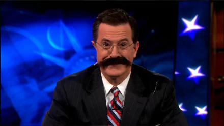 HD desktop wallpaper featuring Stephen Colbert from The Colbert Report, with a patriotic-themed background.