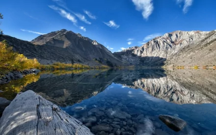 HD desktop wallpaper showcasing Convict Lake in California with clear mountain reflections, vibrant autumn foliage, and a bright blue sky over serene nature.