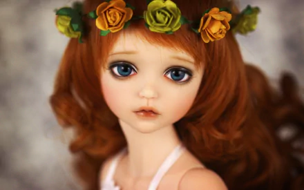 A close-up of a beautifully crafted doll with long, wavy red hair and a floral crown, set against a softly blurred background. An HD wallpaper featuring intricate details.