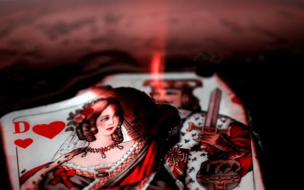 Intricate card design featuring a queen and king, set against a dramatic, dark background, showcasing striking artistry in this HD PC desktop wallpaper.