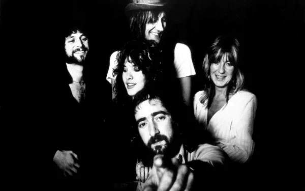 Black and white HD desktop wallpaper featuring the classic Fleetwood Mac band members posing together, capturing their iconic 1970s music era vibe.