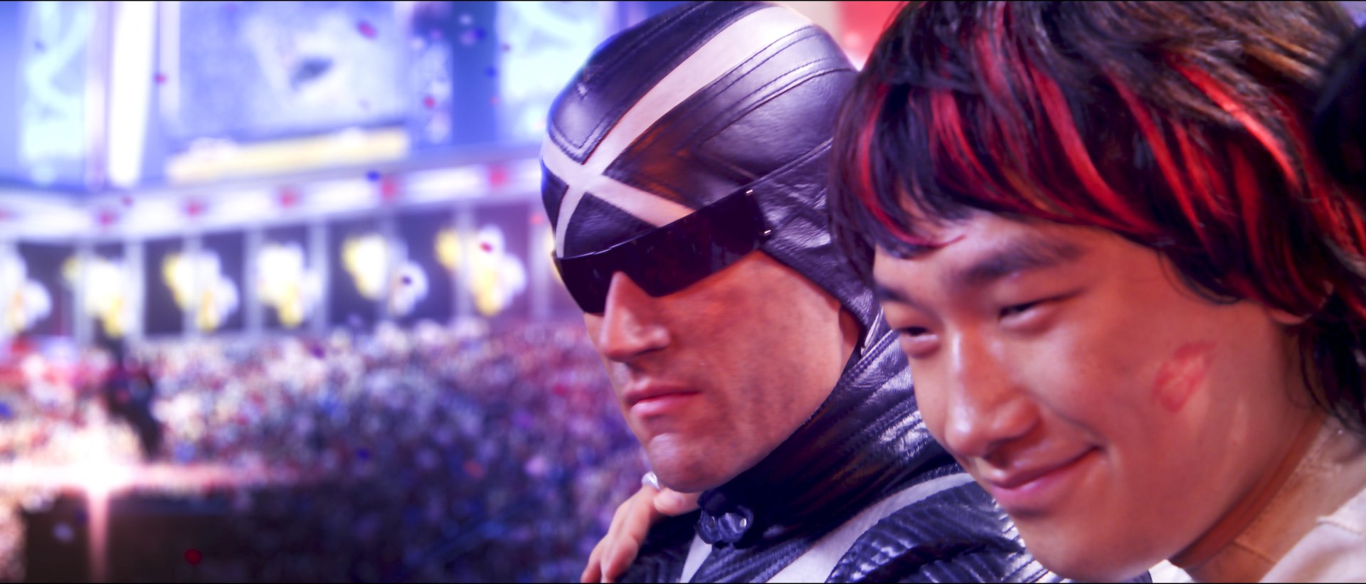 HD PC desktop wallpaper from the movie Speed Racer, featuring a close-up of the main characters with a vibrant, dynamic background.