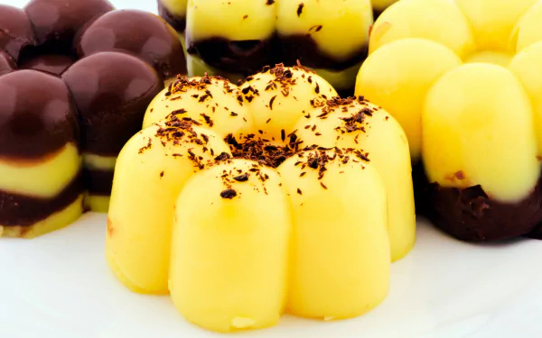 A colorful arrangement of chocolate desserts, featuring brown and yellow layers, showcased as a high-definition PC desktop wallpaper and background.
