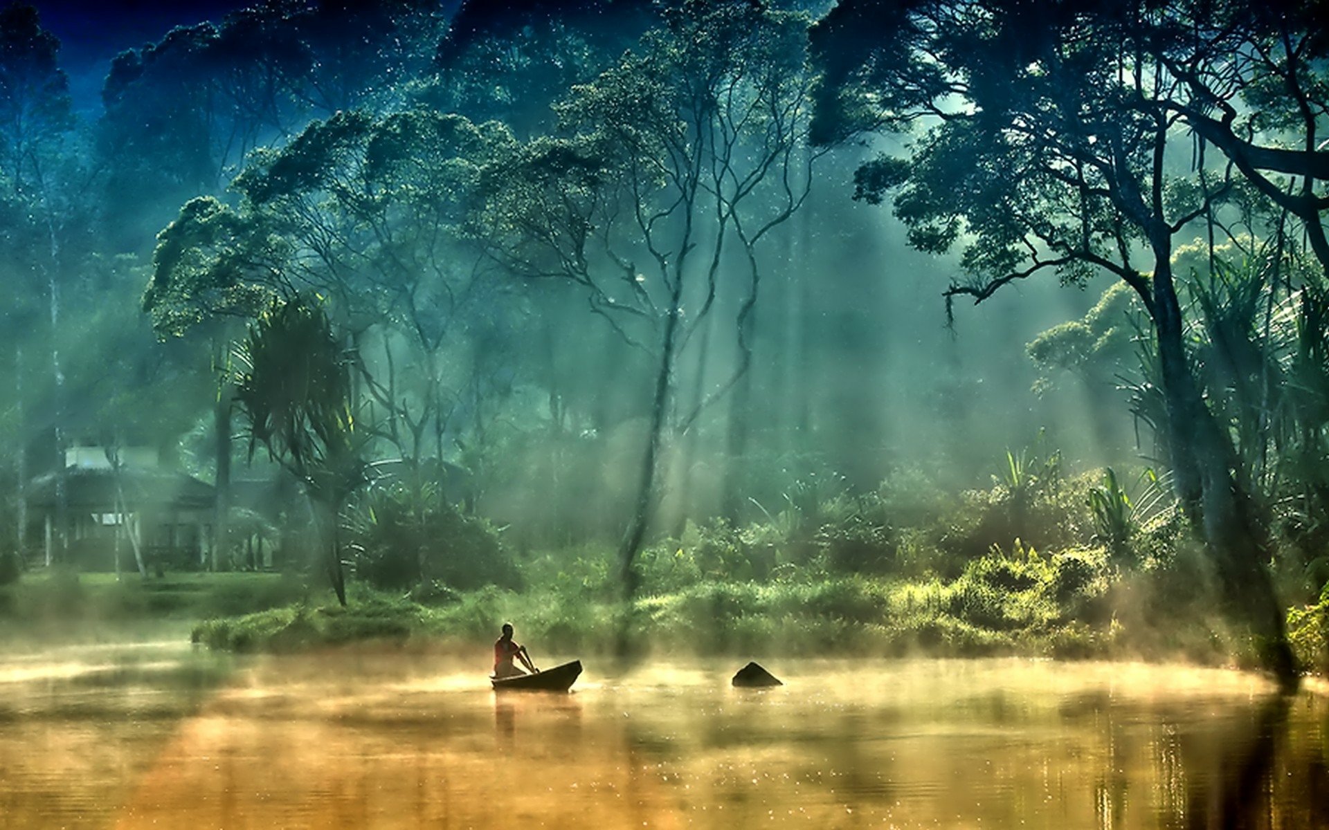 A serene scene featuring a lone figure in a boat on a misty river, surrounded by tall trees. Sunbeams filter through the foliage, creating a tranquil atmosphere. HD photography wallpaper.