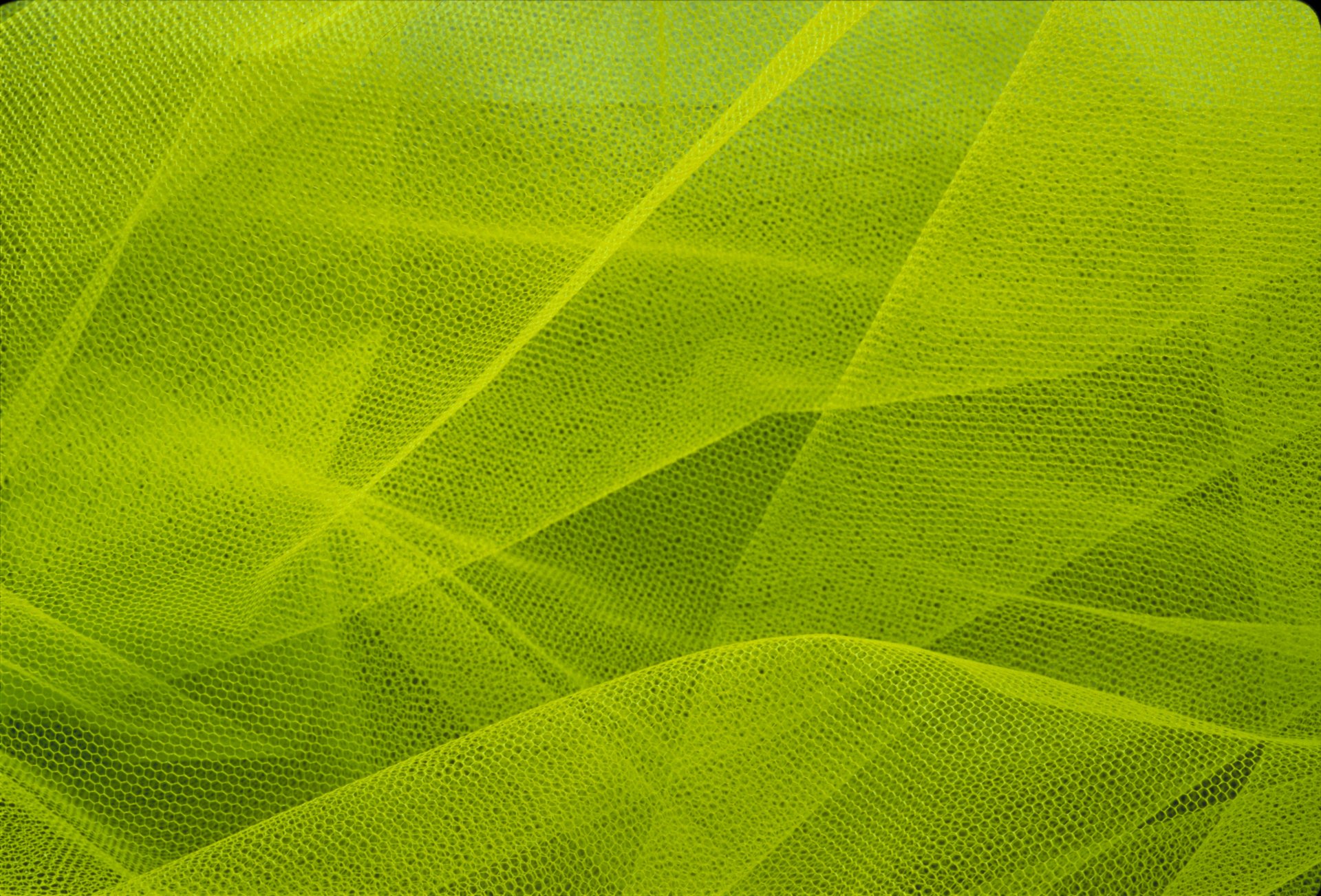 Abstract green textured fabric layers create a vibrant, dynamic composition in this 4K Ultra HD PC desktop wallpaper and background.