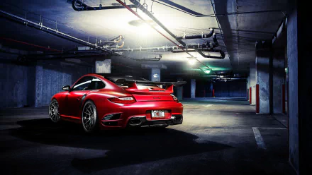 HD PC desktop wallpaper featuring a red Porsche 911 parked in a dimly lit underground garage.