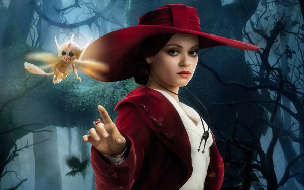 A captivating HD desktop wallpaper from Oz the Great and Powerful, featuring a character in a striking red hat, poised in a mystical forest with a small flying creature.