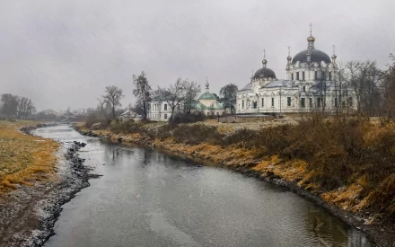 A serene view of a grand palace by a calm river, set against a moody gray sky, creating a tranquil atmosphere. An HD desktop wallpaper showcasing this stunning man-made architecture.