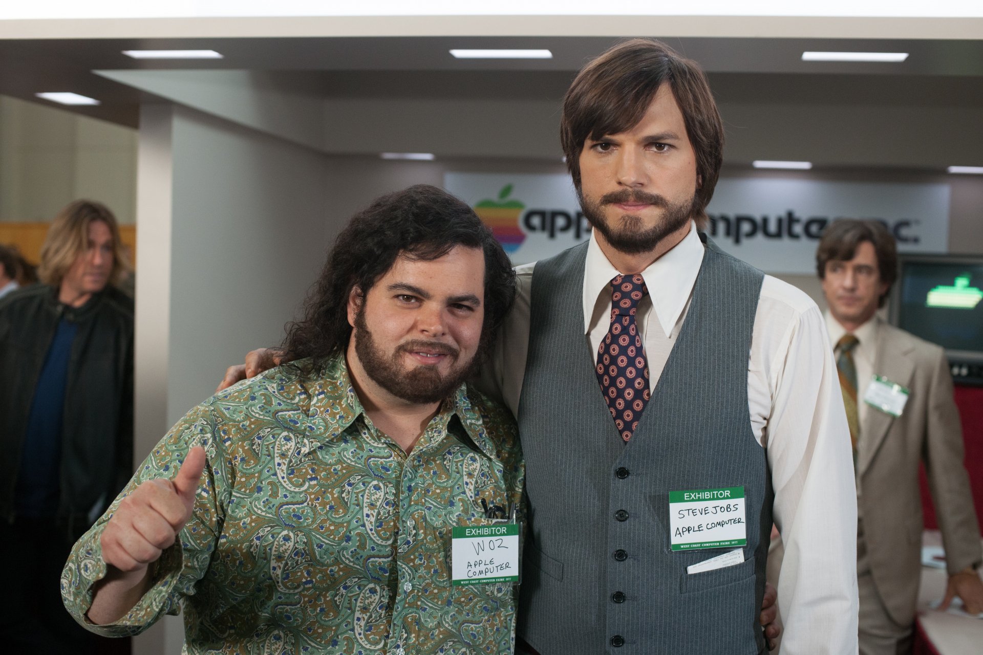 HD desktop wallpaper featuring two men styled as professionals from the retro computing era, representing characters associated with jobs in technology.