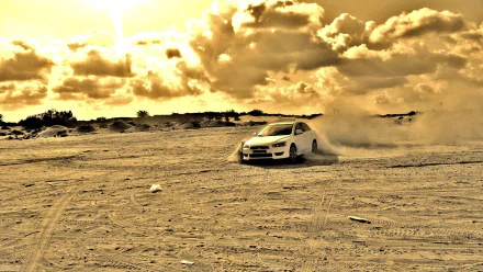 HD PC desktop wallpaper background: Mitsubishi Motors vehicle drifting across sandy terrain, kicking up dust under dramatic golden clouds.