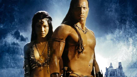 HD desktop wallpaper featuring Kelly Hu and Dwayne Johnson in their roles from the movie The Scorpion King against a dramatic blue background.