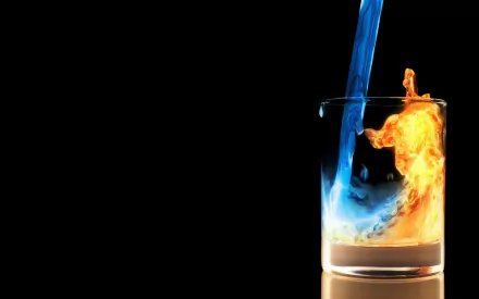 HD desktop wallpaper featuring artistic glass with contrasting blue liquid and orange fire swirling inside against a black background.