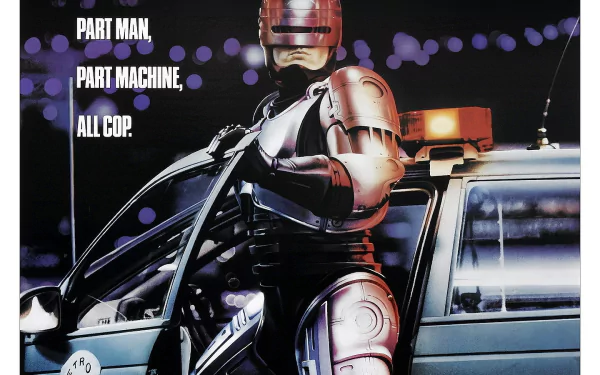 HD PC desktop wallpaper featuring RoboCop from the 1987 movie, standing next to a police car with the text Part Man, Part Machine, All Cop.