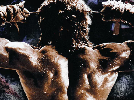 HD desktop wallpaper featuring a muscular scene from Rambo III, highlighting the iconic strength and intensity of the Rambo movie character.