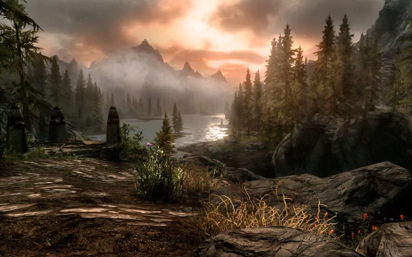 HD desktop wallpaper from The Elder Scrolls V: Skyrim featuring a serene landscape with a misty lake, forests and mountains bathed in sunset light.