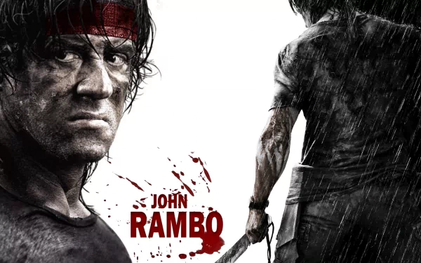 HD desktop wallpaper featuring a gritty image of Rambo in action with the text John Rambo in red, set against a rain-soaked background.