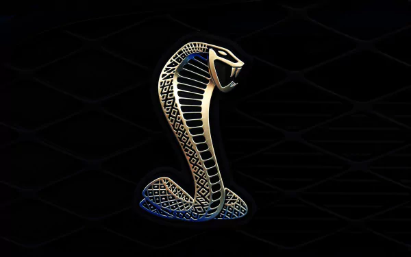 HD desktop wallpaper featuring a sleek Ford Mustang Shelby Cobra GT 500 emblem with a glowing metallic snake design against a dark background.