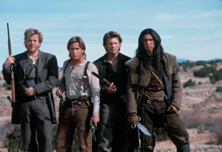 HD PC desktop wallpaper featuring the main cast of the movie Young Guns, standing in a rugged, open landscape with Western attire and weapons.
