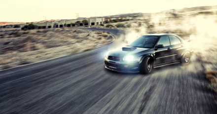 HD desktop wallpaper featuring a black Subaru Impreza WRX drifting on a curved road, kicking up smoke against a blurred desert landscape background.
