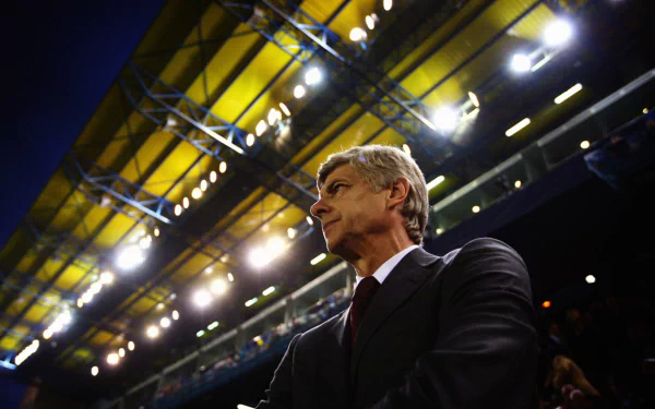 HD PC desktop wallpaper featuring Arsene Wenger in a stadium setting, highlighting his presence in the world of sports.