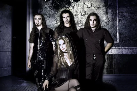 HD PC desktop wallpaper music portrait of a gothic band: female lead seated front, three long‑haired members behind, dark leather outfits and textured concrete backdrop.