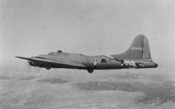 Black and white aerial view of a Boeing B-17 Flying Fortress military bomber in flight, used as an HD PC desktop wallpaper and background.