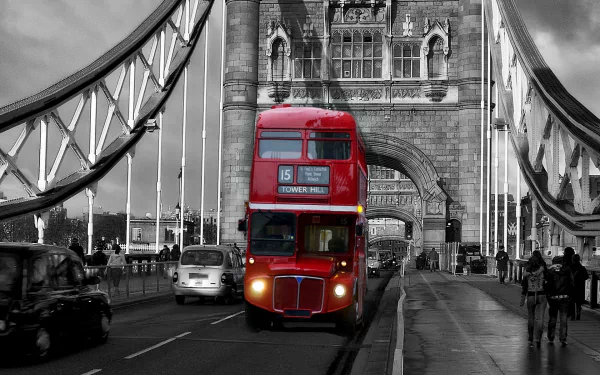 A vibrant red double-decker bus travels across a bridge, surrounded by a black-and-white cityscape, creating a striking contrast in this HD desktop wallpaper.
