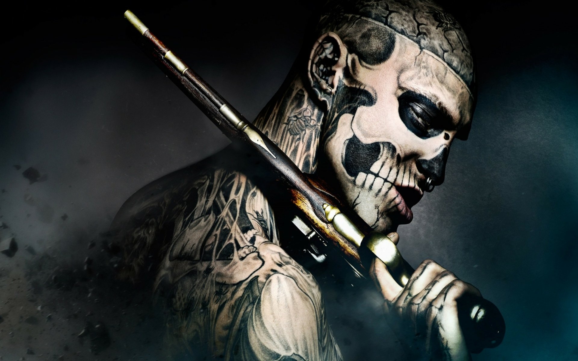 HD desktop wallpaper featuring a character from the movie 47 Ronin with a dramatic tattoo and holding a gun, depicted against a misty, dark backdrop.